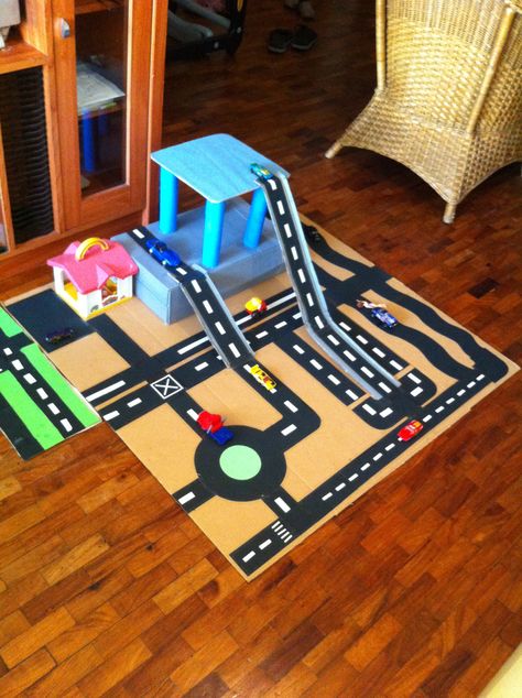 diy car track made from old boxes, art paper and sticker paper Race Car Track Diy Cardboard Boxes, Diy Car Track, Cars Activities, Discovery Activities, Car Tracks For Kids, Cardboard Car, Car Activities, Matchbox Crafts, Kids Homemade