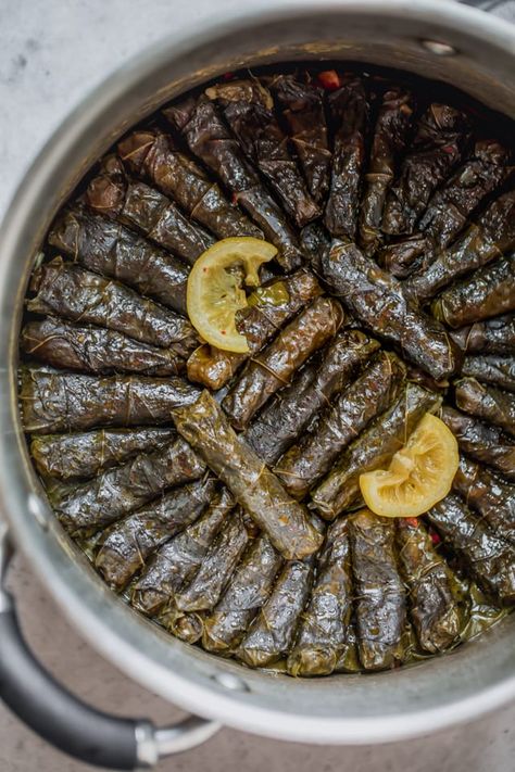 Stuffed Grape Leaves. These Vegetarian Stuffed Grape Leaves are a Mediterranean classic recipe made with short grain rice, parsley, tomatoes and onions - my favorite appetizer! | Easy Appetizers | Healthy Appetizers | Healthy Snacks | #appetizers #healthyrecipes #vegetarian #feelgoodfoodie Grape Leaves Recipe, Stuffed Vine Leaves, Healthy Appetizers Easy, Syrian Food, Stuffed Grape Leaves, Hotels In Paris, Vegetarian Nutrition, Vegetarian Appetizers, Vine Leaves