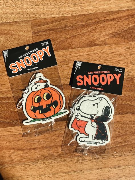 Limited Edition vintage-inspired Snoopy air freshener. Perfect for car, bathroom, office, laundry room, or any other spot that needs a sweet scent with classic Snoopy styling. • Pumpkin Snoopy is pumpkin scented - SOLD OUT • Dracula Snoopy is cinnamon scented • Officially Licensed Product of Peanuts© • Hanging Air Freshener • Approximately 3" with Hanging Elastic Band • Produced and packaged in the USA Available for in-store pickup. Use code LOCAL at checkout. Cars Pumpkin, Snoopy Things, Halloween Stuff, Aesthetic Car Decor, Snoopy Gifts, Pumpkin Scent, Cute Car Accessories, Car Freshener, Sweet Scents