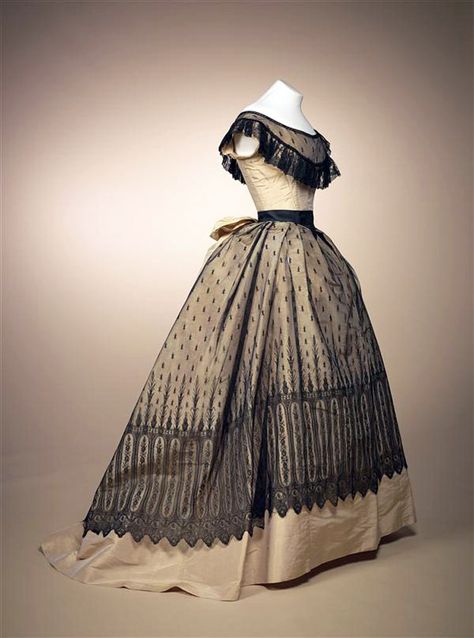 Ball gown, French, 1868. Champagne-colored silk gros de tours with black machine Chantilly lace. Gemeentemuseum den Haag via Europeana Fashions Historical Gowns, 1860 Fashion, Lace Ball Gowns, 19th Century Fashion, Old Dresses, Victorian Clothing, Antique Dress, Retro Mode, Vintage Gowns