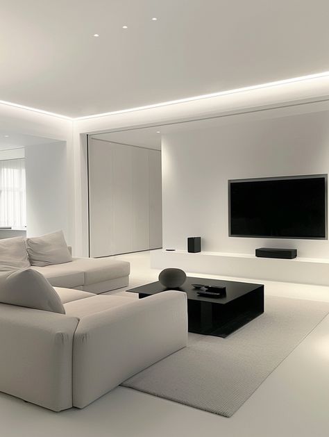 The combination of large-screen TV with black subwoofer and audio equipment,
It shows the fashion and practicality of modern home.
The overall color matching is harmonious and unified,
Without losing modernity,
It also creates a warm and comfortable living atmosphere. Modern Home Living Room Design, Modern Gray And White Living Room, White And Grey House Aesthetic, Minimalist And Modern Living Room, Minimal White Interior, Home Interior Design Apartments, Monochrome Living Room Ideas, Light Gray Aesthetic, All White Living Room