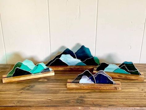 Locally-made stained glass mountains in wooden trough frames. Stained Glass Mountains, Wooden Trough, Stained Glass Wall Art, Diy Stained Glass Window, Fused Glass Wall Art, Glass Picture Frames, Stained Glass Paint, Making Stained Glass, Stained Glass Diy