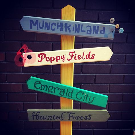 Wizard of Oz themed sign post. Part of the Front of House decorations at The Hexagon Theatre, Reading, UK 17th - 20th May 2017 #noplacelikehome #imadethis www.sainsburysingers.org.uk Homestead Act, Wizard Of Oz Decor, Haunted Forest, Halloween Parade, Business Decor, Yellow Brick Road, Sign Post, Emerald City, Library Decor