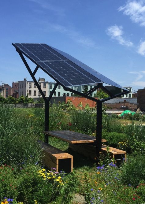 If you are going to work on your computer outside you need shade, and the solar panels set up over the table conveniently provide it plus the power if you need it. Solar Panel Garden, Solar Panel Roof Design, Green Roof Planting, Brooklyn Rooftop, Eco Roof, Roof Plants, Solar Energy Design, Green Roof System, Urban Heat Island