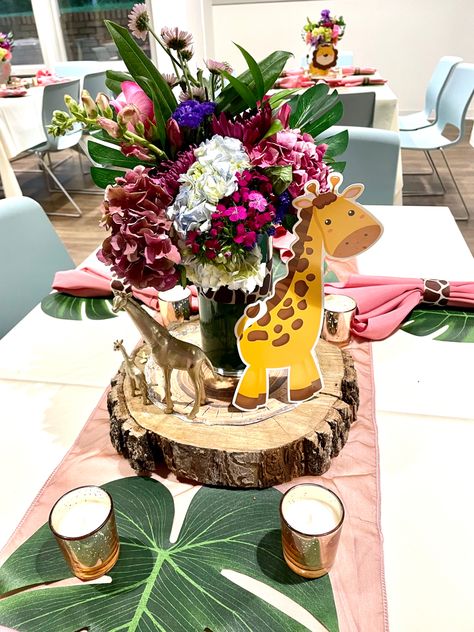 Safari themed baby shower with giraffe centerpiece - giraffe print napkin rings, giraffe print vase, giraffe animal figurines Safari Theme Floral Arrangements, Safari Baby Shower Girl Centerpieces, Giraffe Baby Shower Theme Girl, Giraffe Centerpieces, Safari Baby Shower Girl, Giraffe Baby Shower Theme, Pink Baby Shower Centerpieces, Safari Baby Girl, Baby Shower Table Set Up