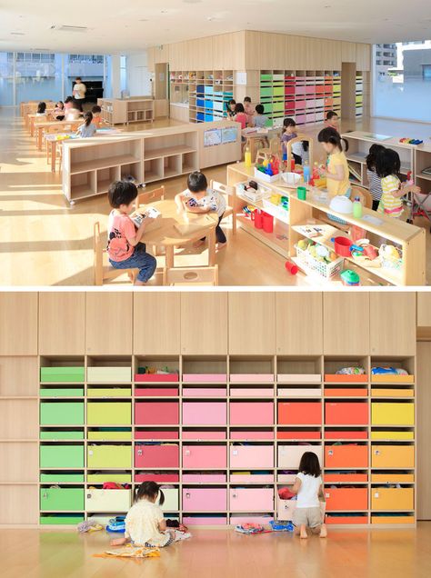 In the main nursery room in this modern kindergarten, 200 colorful boxes in 25 colors are lined up on the wall, allowing each child to know which color belongs to them and where they can keep their personal items.   emmanuelle moureaux architecture + design have recently completed Creche Ropponmatsu, a new kindergarten located in a residential area in Fukuoka city, Japan. Modern Kindergarten, Kindergarten Building, Kindergarten Classroom Design, Kindergarten Interior, Preschool Designs, Classroom Interior, Daycare Design, Kindergarten Design, School Interior