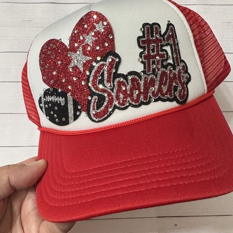 These custom trucker hats are super sparkly and a fun way to promote your favorite team. we can customize the colors, team name, number, and sport to your liking. With so many colors to choose from, the color combinations are endless.  We are happy to answer any questions. The hats are adjustable and fit most sizes.  Trucker style hats are made with a foam front, mesh back, and plastic adjustable closure. Football Mom Trucker Hats, Game Day Team-colored Trucker Hat With Letter Print, Team-colored Trucker Hat With Letter Print For Game Day, Customizable Sports Hat For Fans, Customizable Sports Fan Hats For Fan Gear, Team-colored Trucker Hat With Letter Print For Fans, Customizable Sports Fan Trucker Hat, Red Letter Print Trucker Hat For Sports Events, Sports Fan Trucker Hat With Letter Print