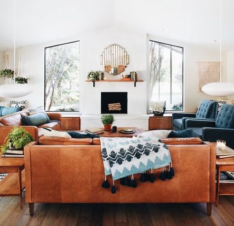 a couple of amber leather sofas and navy chairs create a nice and welcoming conversation pit in mid century modern style Tan Living Room, Living Tv, Leather Couch, Living Room Remodel, Room Remodeling, A Living Room, Couches Living Room, Farmhouse Living, Reading Nook