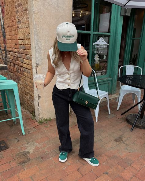 You can usually find me with a coffee, baggy jeans and sneakers ☕️🖤🤍 Vest: @hm Jeans: @abercrombie Sneakers: @adidas Hat: @amazonfashion Bag: @amazon Jewelry: @bypavoi #ootd #denimstyle #minimalstyle #streetstyle #pinterestinspired #ootdfashion #minimalstreetstyle Outfit of the day, street style, trucker hat outfit, baggy jeans outfit, outfit inspo, outfit ideas, minimal street style, pops of green, cool girl outfit, casual outfit, basic outfit Adidas With Jeans Outfit, Green Adidas Outfit Women, Green Trucker Hat Outfit, Green Adidas Outfit, Outfit With Baseball Hat, Green Sneakers Outfit, Green Hat Outfit, Green Bag Outfit, Hm Jeans