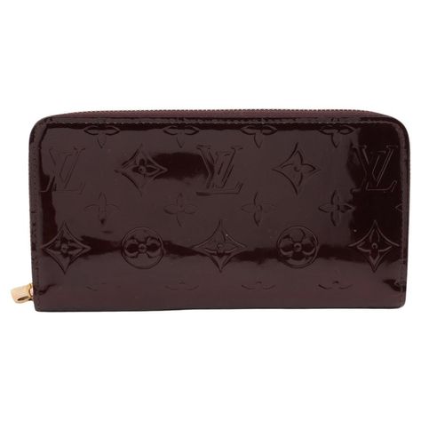 The Louis Vuitton Monogram Vernis Zippy Wallet in Amarante is a luxurious and elegant accessory, perfect for organizing your essentials. Crafted from glossy Monogram Vernis patent leather in a deep, rich Amarante hue, it exudes sophistication and charm. The wallet features a secure zip-around closure and a well-organized interior, including multiple card slots, a zippered coin pocket, and compartments for bills and receipts. The gold-tone hardware and discreet Louis Vuitton logo embossing complete the refined look, making it an ideal choice for those who appreciate timeless style and practicality. RANK A Date Code: CA2039 Number of Card Cases: 8