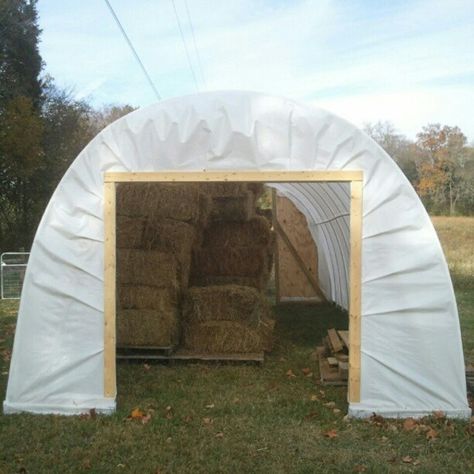 The $500 Hoop House for Hay Storage — LITTLE SEED FARM  Interesting way to sandwich the plastic between boards to secure around the doorway. Pallet Hay Storage, Round Bale Storage Ideas, Hay Bale Storage Ideas, Hay Storage Ideas Horses, Diy Hay Storage, Round Bale Storage, Hay Storage Ideas Barns, Hay Barn Ideas, Hay Storage Ideas