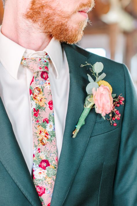 Jack decided to ditch the classic black tie and opt for one that was covered in the flowers that were a part of the rest of their wedding. Follow our social media for more of Katie and Jack's dreamy wildflower wedding! IG: @maurajanesphoto | Website: maurajanephotography.com Colorful Wedding Outfit Men, Groom Floral Shirt, Colorful Wedding Suits Men, Groom Attire Garden Wedding, Men’s Wedding Looks, Wildflower Wedding Groom Suit, Wildflower Wedding Suit, Floral Groom Suit, Wildflower Groomsmen