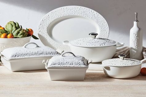 So what if you’re planning to spend this summer catching up with friends and family stateside? You can still bring a touch of Europe to your tablescape with Le Creuset’s stunning new Olive Branch Collection. Inspired by the French countryside, the collection includes pieces that are embossed with a delicate olive branch motif and finished in a soft matte texture to emulate the sun-drenched fields of Provence. Le Creuset Olive Branch Collection, Le Creuset Olive Branch, Le Crueset Pots Aesthetic, Le Creuset Collection, Le Crueset Pots, Le Creuset Aesthetic, Kitchen Dishes Sets, Le Creuset Olive, Le Creuset White