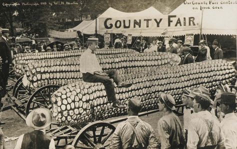 Our County Fair contest on Iowa corn, W. H. Martin, ca. 1910s, Gift of Charles Isaacs and Carol Nigro, Smithsonian American Art Museum. Ears Of Corn, History Of Photography, Man Sitting, Smithsonian Institution, County Fair, Antique Postcard, Photo Postcards, Historical Society, Vintage Postcard