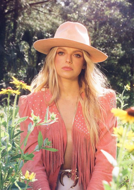 Carter Faith sitting in a field of flowers (2023) Country Singer Photoshoot, Carter Faith, Singer Photoshoot, Sitting In A Field, Flowers 2023, Cowboy Carter, A Field Of Flowers, The Sound Of Waves, Country Singer