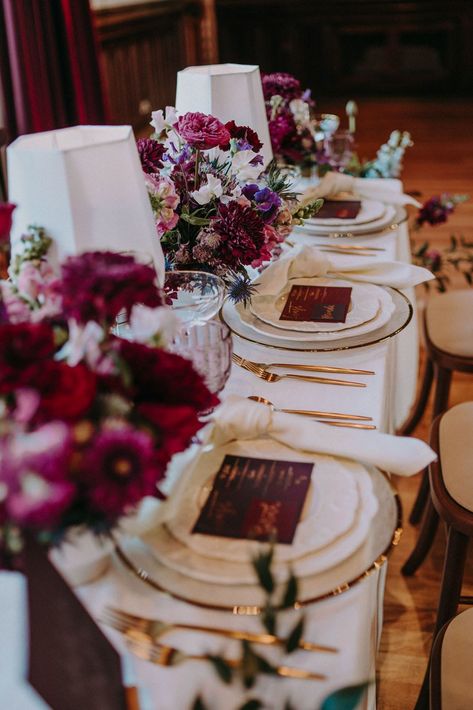 Burgundy, red, purple and pink wedding table decor with floral centrepieces, coloured glassware and gold cutlery | Shot by Bek Burgundy And Purple Wedding Table Settings, Purple Red Wedding Decor, Dark Purple And Pink Wedding Theme, Red Purple And Gold Wedding, Plum Wedding Colors Colour Palettes, Plum And Burgundy Wedding, Red And Purple Wedding Theme, Burgundy And Purple Wedding, Sangria Wedding Colors