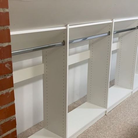 Neatly Dunn on Instagram: "TransformationTuesday: When you’re trying to utilize that awkward space with the low knee wall and it’s just not working... Reach out to me! I can help! This once awkward space is now an extremely functional custom closet! This closet now offers short and long hanging, shoe storage, shelves for folded clothes, an island with lockable drawers which also doubles as a folding station, velvet liners in a couple of the drawers for jewelry, a fabulous custom necklace pull out panel, valet rods, tilt-out hampers, and a folding pull out ironing board! What more could you want in a closet? Tell me what you’d like to have in your closet. #neatlydunn #closetfactory #ClosetFactoryRaleigh #ClosetFactoryDesigner #Customstorage #GetOrganized #closetsofinstagram #CustomC Knee Wall Storage Ideas, Slanted Closet Ideas, Knee Wall Closet, Knee Wall Storage, Under Eaves Storage, Shoe Storage Shelves, Tilt Out Hamper, Wall Shoe Storage, Pull Out Ironing Board