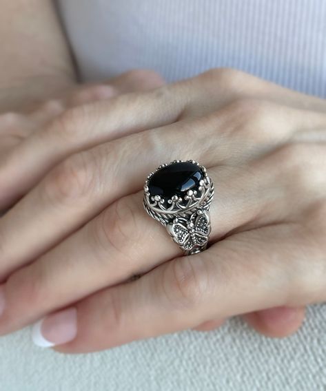 🦋✨ Transform your look with the elegance of nature! Our exquisite 925 Sterling Silver Filigree Butterfly Cocktail Ring is a true masterpiece, featuring intricate details and the captivating allure of Black Onyx - a gemstone fit for January babies and beyond! 🖤 Ready to make a statement? Flutter over to our #EtsyShop and let your style soar. Click to discover or indulge: https://nuel.ink/BQpy5P #SterlingSilver #BirthstoneBling #ButterflyJewelry #HandmadeLuxury Silver Rings With Black Stones, Onyx Stone Ring, Black Onyx Rings Women, Onyx Rings Women, Black Stone Ring Women, Butterfly Cocktail, Black Gemstone Ring, Stone Ring Design, Jewelry Rings Unique