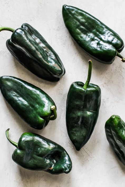 Learn how to make roasted poblano peppers in an oven or over an open flame for use in many delicious recipes! Ready in 15 minutes or less! #poblanos #roastedpoblanos #mexicanrecipes Rellenos Recipe, Poblano Peppers Recipes, Ground Beef Breakfast, Roasted Poblano Peppers, Ancho Chili Powder, Chile Poblano, Ancho Chili, Poblano Peppers, Mexican Cooking