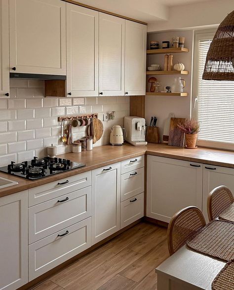 This kitchen has a white color scheme that is able to make the kitchen look bright and clean. Then, it is added with the brown wood color for a warm impression and not to make the decoration look boring. Bright Neutral Color Scheme from @mycozyhomely Small Kitchen Decor, 아파트 인테리어, Scandinavian Kitchen, Kitchen Room Design, Kitchen Inspiration Design, Design Kitchen, Ornament Crafts, White Cabinets, Kitchen Style