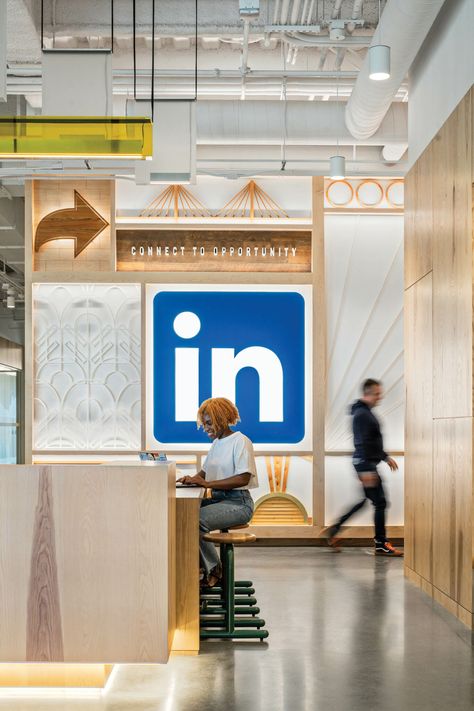 The LinkedIn Office in Omaha Captures the Spirit of the Midwest Environmental Graphics Office, Office Graphics, Commercial Office Design, Built In Banquette, White Wash Brick, Communal Table, Retail Inspiration, Real Estate Office, Environmental Graphic Design