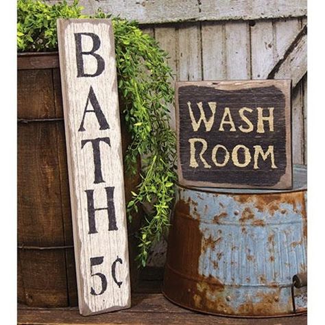 The Wash Room Barnwood Sign is a decorative sign made of chunky, distressed barn-style wood. The sign is given a washed black paint finish and reads “Wash Room” in painted ivory lettering. This sign is perfect for a primitive or farmhouse theme, displayed freestanding or hanging on a wall, using the wire hanger, in any Tin Bathroom Ideas, Primitive Bathroom Decor, Primitive Bathroom, Barn Bathroom, Rustic Farmhouse Bathroom, Bath Sign, Wash Room, Bathroom Towel Decor, Farmhouse Theme