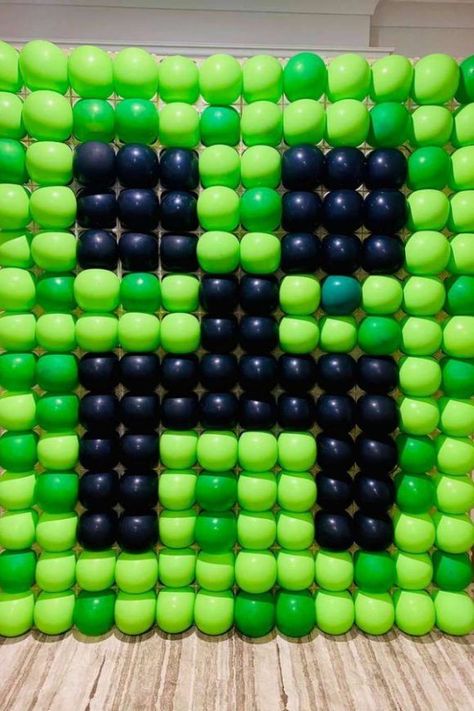 Now, this is one party decoration that will blow everyone away. Create a Creeper balloon wall with a bunch of green and black balloons. Place them behind your dessert table or as a photo booth backdrop. Whichever way you choose to use it you can never really go wrong! See more party ideas and share yours at CatchMyParty.com Birthday Minecraft Ideas, Minecraft Zombie Birthday Party, Videogame Birthday Party, Minecraft Birthday Party Backdrop, Minecraft Birthday Party Ideas Games, Minecraft Decoration Ideas For Birthday, Minecraft Party Diy, Minecraft Games For Birthday Parties, Minecraft Birthday Ideas