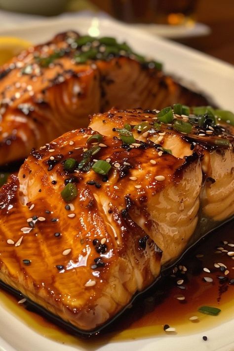 Ginger Soy Glazed Salmon is a savory and flavorful dish that’s perfect for any occasion! 🍣🧄 This dish features tender salmon fillets coated in a delicious ginger soy glaze, creating a perfect balance of sweet and savory flavors. Quick and easy to prepare, Ginger Soy Glazed Salmon is ideal for a weeknight dinner or a special meal. Treat yourself to this healthy and mouthwatering delight today! 😋🌿 #GingerSoySalmon #HealthyEating #FlavorfulMeals #SeafoodLovers Soy Glazed Salmon, Healthy Salmon Dinner, Salmon Fillet Recipes, Soy Glaze, Lemon Garlic Salmon, Ginger Salmon, Fish Recipes Baked, Sauce For Salmon, Delicious Seafood Recipes