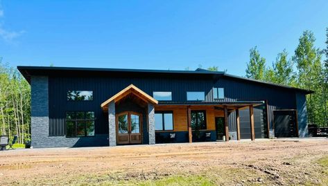 Today’s featured barndominium is an exciting and mold-busting example of just how far these homes have come. Featuring all the top-tier features and luxury amenities found in high-end real estate, this Wisconsin barndominium is beautifully stylish and modern. Exterior – Wisconsin Barndominium Not many people who drive by this exceptional Wisconsin barndominium would guess that … Modern Mountain Barndominium, Modern Style Barndominium, Barndominium Entrance, Mcm Barndominium, 2400 Sq Ft Barndominium, Black Barndominium Exterior Modern, Scandinavian Barndominium, Open Barndominium, Barndominium Ideas One Story