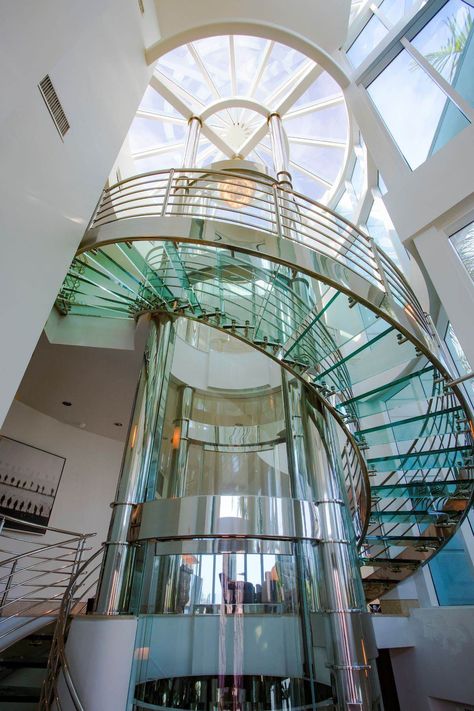 Florida beach pad with round glass elevator for $6M - Curbed Miami Spiral Glass Staircase, Circular Elevator, Stairs Elevation, Round Elevator, Staircase Slide, Round Stairs, Glass Architecture, Circular Stairs, Florida Beach House