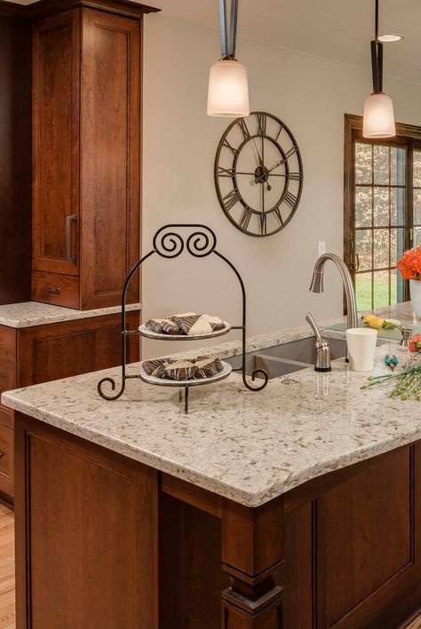 Cambria Windermere quartz countertop kitchen is to use with full dark color cabinets and light oak flooring. #cambriawindermerequartzcountertop #cambriawindermerekitchencounter #cambriawindermerequartzkitchentop #darkcabinet #darkcabinetry #darkcupboard #pendantlight #lighthardwoodfloor #lightcolorwoodflooring #cambriacolors #cambriaquartzcountertop #cambriakitchencounter #cambriaquartztop #maintanencefreecountertop #cambriacountertopideas #lightoakflooring Quartz Countertops With Brown Cabinets, Cambria Quartz Kitchen Countertops, Light Oak Hardwood Floors, Quartz Kitchen Countertops White, Kitchen Countertops Ideas, Dark Oak Cabinets, Quartz Countertops Colors, White Oak Cabinets, Cabinets With Crown Molding