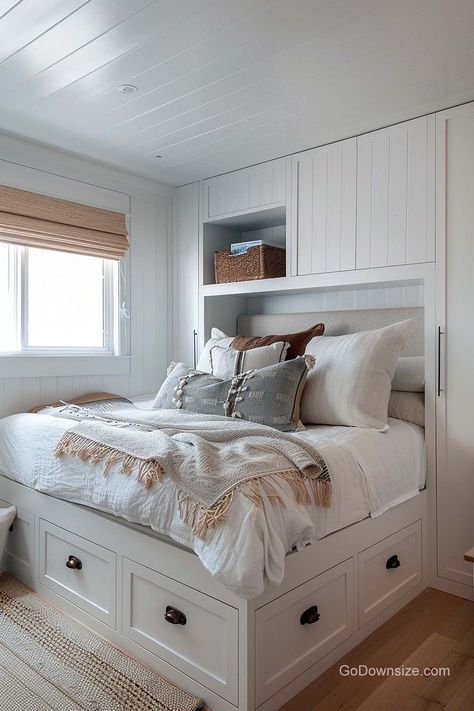 In this compact bedroom featuring a platform bed with storage both above and below, functionality seamlessly merges with a minimalist design to create a space that is both practical and stylish. Storage Above Bed, Compact Bedroom, Scandinavian Bedrooms, Platform Bedroom, Platform Bed With Storage, Bedroom Idea, Bed With Storage, Scandinavian Interior Design, Above Bed