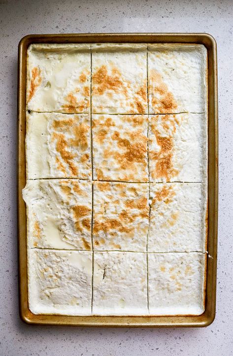 Top down view of a sheet pan of egg whites cut into 12 squares. Egg White Sheet Pan, Egg Whites In Oven, Egg White Sheet Pan Eggs, How To Use Egg Whites, Baked Egg Whites In Oven, Sheet Pan Egg Whites, Baked Egg Whites, Egg White Breakfast Sandwich, Egg White Bake