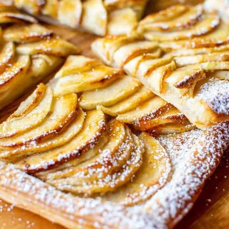 Incredibly easy to make, this Puff Pastry Apple Tart uses store bought frozen puff pastry and fresh, tart apples. This Puff pastry Apple Tart recipe is a great choice for those times when you want an easy dessert that looks impressive!! #marcellinaincucina #puffpastryappletart #dessert #apple #recipe Apple Pie With Puff Pastry, Apple Strudle, Deviled Crab Recipe, Puff Pastry Apple Tart, Apple Recipes With Puff Pastry, Recipes With Puff Pastry, Pear Tarts, Deviled Crab, Recipe Apple Pie