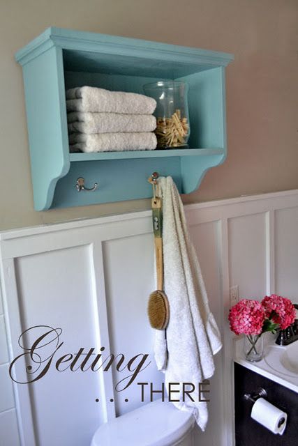 DIY bathroom storage shelf. Love this one...even the color scheme. Hooks In Bathroom, Shelves With Hooks, Vintage Shelves, Bathroom Shelf With Hooks, Store Towels, Shelf With Hooks, Wall Storage Shelves, Over The Toilet, Diy Bathroom Storage