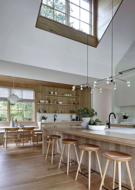 Step into this welcoming and warm beach house getaway in Amagansett Beach House Getaway, Beach House Renovation, Beach House Aesthetic, Caesarstone Countertop, Clean Workspace, Built In Banquette, Shingle Style Homes, Travertine Coffee Table, Teak Sofa