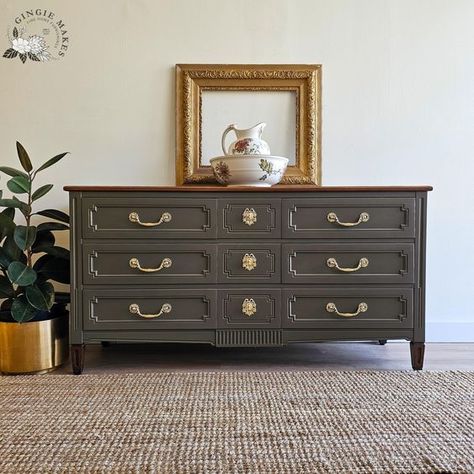 this Cherry triple dresser has had a beautiful update, modernizing the piece while keeping its Provincial charm. The top was brought down to the raw cherry and then stained a rich brown. The body was painted in high quality mineral paint in a stunning neutral with green and brown undertones. . . #solidwood #vintage #modern #restoredfurniture #c #credenza #dyi #shoplocal #DIYFurniture #furniturerefurbishing #furniturerefurbished #furniturerefurbish #furniturerefinishing #furniturerefinish #fu... Triple Dresser, Vintage Dresser, Brown Paint, Painted Dresser, Vintage Dressers, Bedroom Furniture Dresser, Furniture Restoration, Mineral Paint, Popular Color