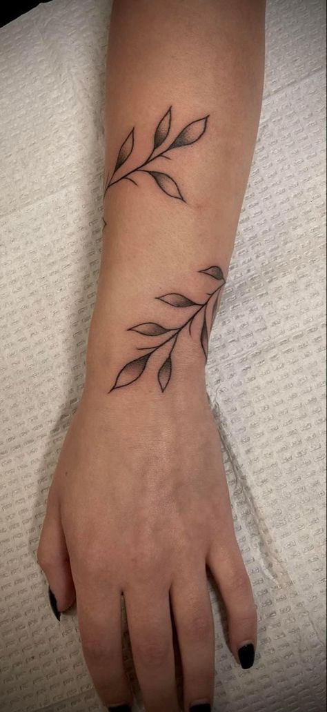 A list featuring all kinds of wrist tattoos to inspire your personal design. Vine Patchwork Tattoo, Leaf Wrap Around Tattoo Arm, Wraparound Tattoo, Around Arm Tattoo, Wrap Around Tattoo, Wrist Tattoo Ideas, Vine Tattoo, Hand And Finger Tattoos, Cute Lanyards