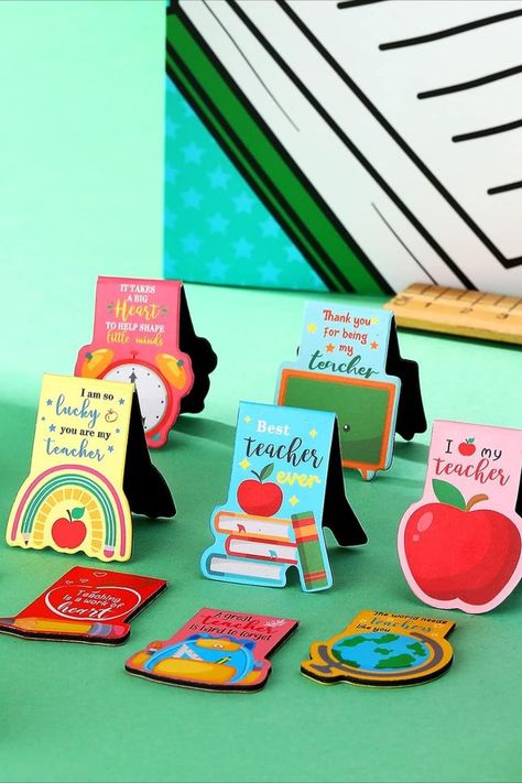 Celebrate your teacher's dedication with the perfect gift! This set of magnet bookmark clips, available in 10 charming styles, ensures you'll always have a reliable marker at hand. They slip into any book without effort. Adorned with delightful Teacher's Day motifs like books, clocks, and apples, they capture the essence of teaching. Suitable for students, professionals, and various settings, these magnetic bookmarks add a touch of practicality to every page-turning moment. Teachers Day Bookmark, Magnets With Cricut, Bookmarks For Teachers, Magnet Bookmark, Teacher Bookmark, Teacher Wallpaper, Message For Teacher, Expo Marker, Teachers Day Card