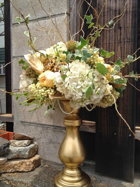 Large Gold Vase Centerpieces, Gold Floral Arrangements, Floor Vase Arrangement Gold, Gold Vase Floral Arrangement, White Floral Centerpiece In Gold Vase, Gold Vase Center Pieces, Gold Bouquet, Large Flower Arrangements, Gold Spray