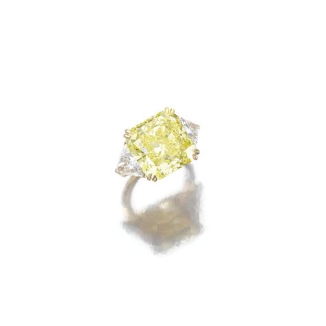 Fancy Intense Yellow diamond ring, Cartier. Claw-set with a fancy intense yellow round-cornered square modified brilliant-cut diamond weighing 15.85 carats, flanked by triangular diamonds, mounted in yellow gold. Yellow Diamond Ring, Yellow Diamond Rings, International Jewelry, Cartier Jewelry, Shine Bright Like A Diamond, Cartier Ring, Yellow Diamond, Geneva, Girls Best Friend