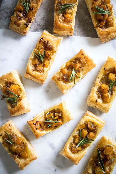 These Pumpkin & Rosemary Puff Pastry Bites are incredibly easy to pull together and make for the perfect bite-sized fall appetizer. Savory Fall Pastries, Pumpkin Appetizers Savory, Fall Small Bites, Thanksgiving Appetizers Puff Pastry, Fall Party Hourderves, Fall Appetizers For A Crowd, Vegan Holiday Appetizers Christmas, Savory Pumpkin Appetizers, Bite Size Thanksgiving Appetizers