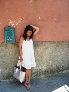 What to wear in Cinque Terre Italy What To Wear In Italy, Beach White Dress, Denim Jumpsuits, Secret Escapes, Italian Riviera, Cinque Terre Italy, Expensive Handbags, Silver Clutch, Ladies Clothes