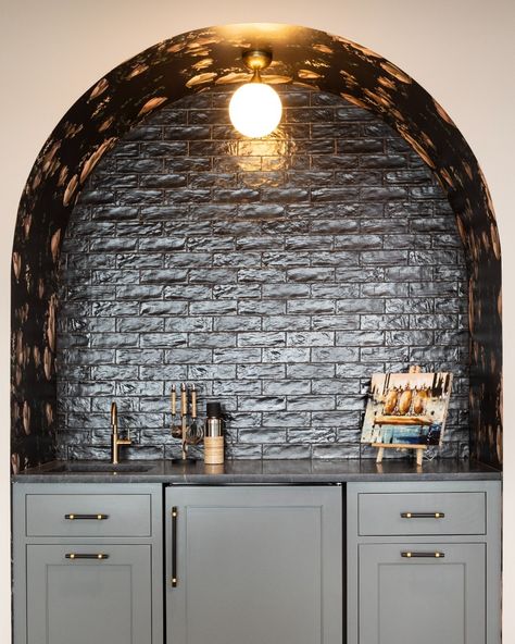 Peep the clever wallpaper placement 👀 —— Built-in bar, arched architecture, wallpaper nook, brick backsplash, modern design, home bar, cabinets. Bar Arch, Dry Bar Backsplash, Kitchen Bar Nook, Tile Backsplash Bar, Dry Bar Built In, Arched Bar Area, Arched Kitchen Cabinets, Arched Built In Dry Bar, Arched Built In Bar