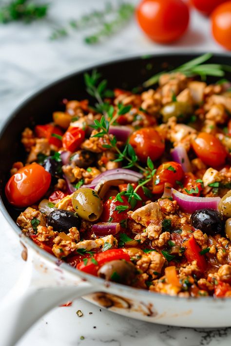 Satisfying Mediterranean Keto Ground Chicken Skillet with Olives and Feta Recipe #ketodiet #ketorecipes #lowcarb Mediterranean Turkey Skillet, Dinner Recipes With Olives, Mediterranean Diet Family Dinners, Ground Turkey Cherry Tomatoes, Low Carb Mediterranean Recipes Dinners, Ground Chicken Recipes Mediterranean, Mediterranean Protein Recipes, Low Food Map Dinner Recipes, Ground Turkey Mediterranean Bowl