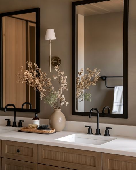 Neutral tones, natural materials, and black fixtures come together beautifully in these bathroom designs. The serene color palette and modern accents create a spa-like atmosphere that’s both elegant and relaxing. Perfect inspiration for your next bathroom makeover. 🚿✨ #bathroom #bathroominspo #bathroomideas #bathroomgoals #bathroomdecor #interiorinspiration #interior123 #interior2you #minimalistinterior #minimalisthome #minimalisthomedecor #organicmodern #homeinspo #roomforinspo #interior... Powder Room Ideas Neutral, Brown Guest Bathroom, Modern Bathtub Decor, Beige Bathroom With Black Accents, Mixing Wood Tones Bathroom, Neutral Bathroom Black Accents, Beige Guest Bathroom, Beige Brown Bathroom Ideas, Beige Bathroom With Black Fixtures