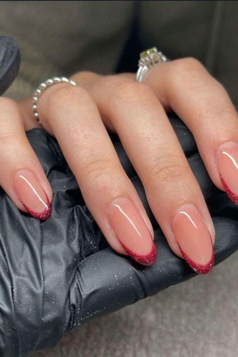 If you love the red color but prefer a more subtle look for your nails, this option is perfect for you. You can still add a touch of glamour by making them shiny.

These red shiny fall almond nails will help you blend in effortlessly no matter where you go or what time of day it is.//photocredit:@jxannnails Sparkly French Tip Nails, Sparkly French Tips, Fall Almond Nails, Red French Tip, Red Tips, Engagement Nails, Fall Nail Inspo, Red French, Cherry Nails