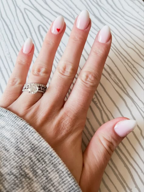 Wedding Nails French Tip With Heart, White Almond Nails With Pink Heart, Pink Ombre Nails With Hearts, Nails With One Heart On Ring Finger, Dip Powder Nails Heart Design, Ombre With Heart Nails, Heart Detail Nails, Ombre Nail With Heart, Small White Heart Nails