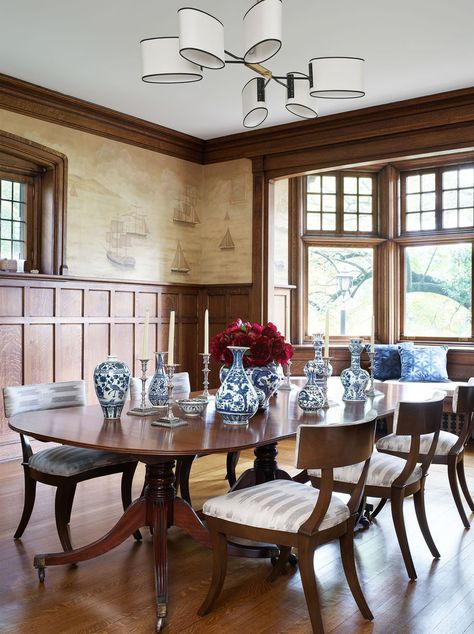 The theme of Designer Janine Carendi MacMurray's design was “coming home.” The clients wanted the house to feel sophisticated, light, and contemporary while honoring the family’s history. #pittsburgh #pittsburghhome #home #interiordesign #renovation #architecture #remodel #modernhome #tudorhome #design #decor #elledecor Tudor Design Elements, English Tudor Dining Room, Modern Tudor Dining Room, Tudor Dining Room, Tudor Revival Interior, Arts And Crafts Dining Room, Tudor Revival House, Tudor Decor, Hallway Colours