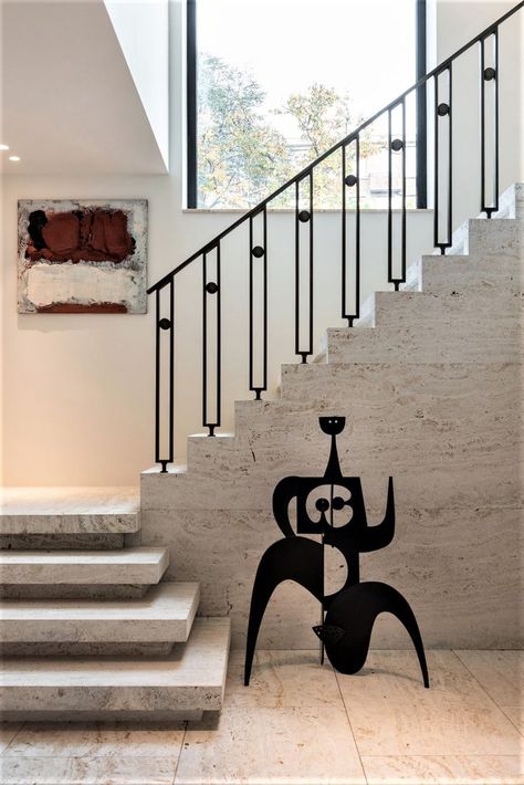 SVAREF High-end interior design inspiration reference image of an abstract black steel Calder like sculpture in a modern hallway Stairs Rails, Staircase Interior, Black Sculpture, Interior Stair Railing, Staircase Interior Design, Stairs Railing, Mediterranean Interior Design, Staircase Railing Design, Handrail Design